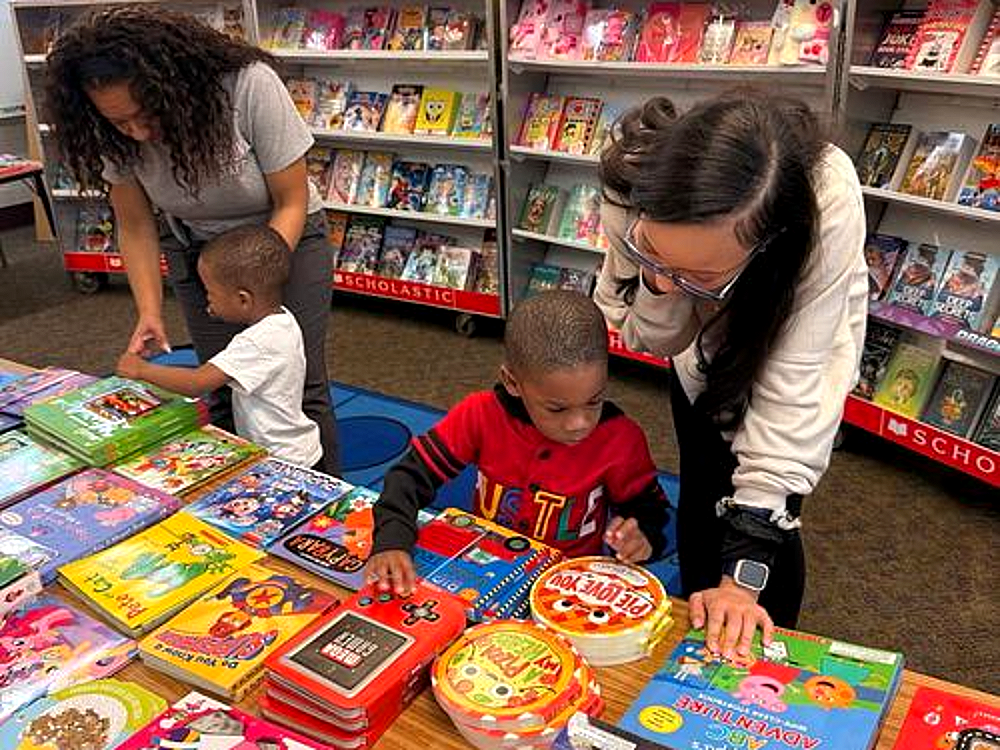 Beacon families browse books at the Scholastic book fair