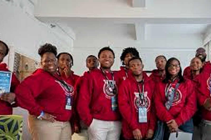 CCI BPA students in chapter jackets at a conference