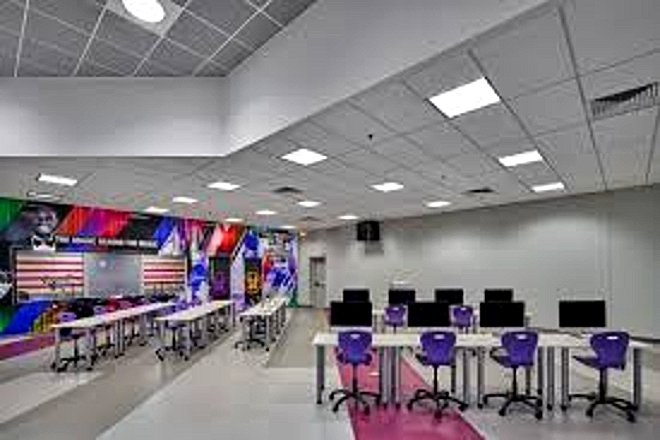 CCI technology lab with student workstations and a mural wall