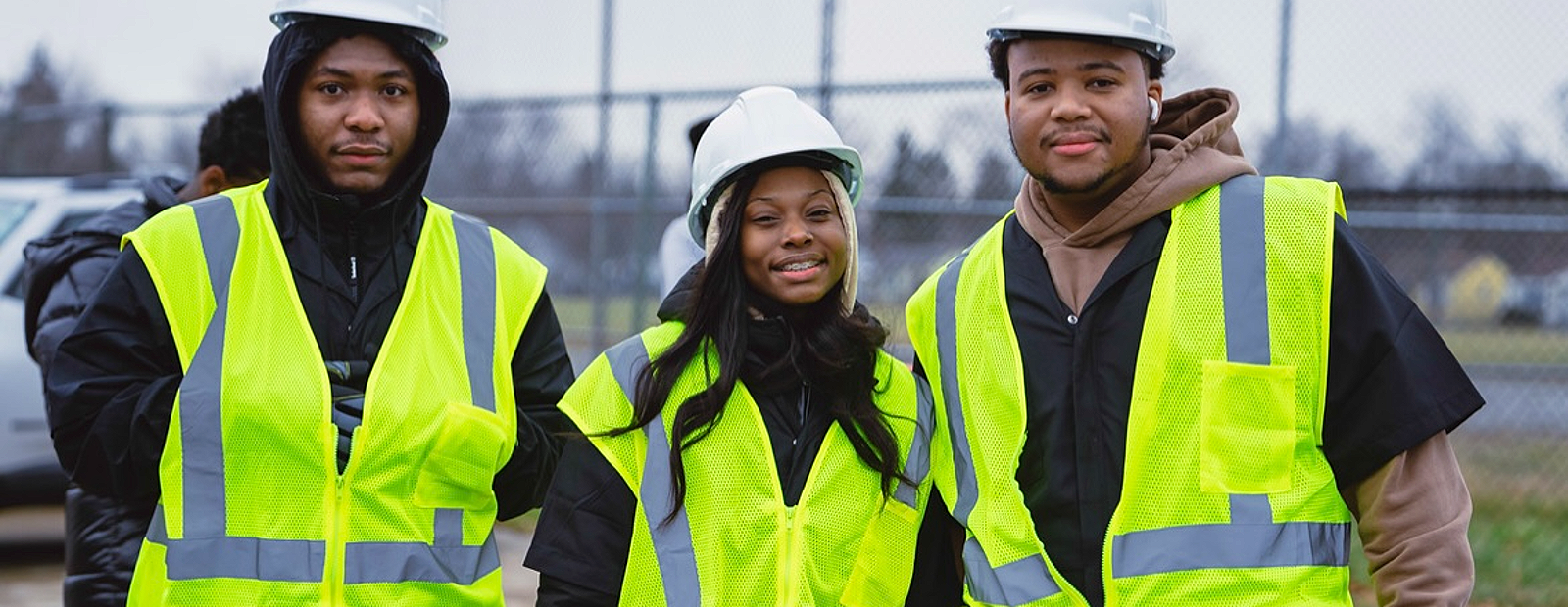 Harper Woods CCI construction trades students in hard hats and safety vests
