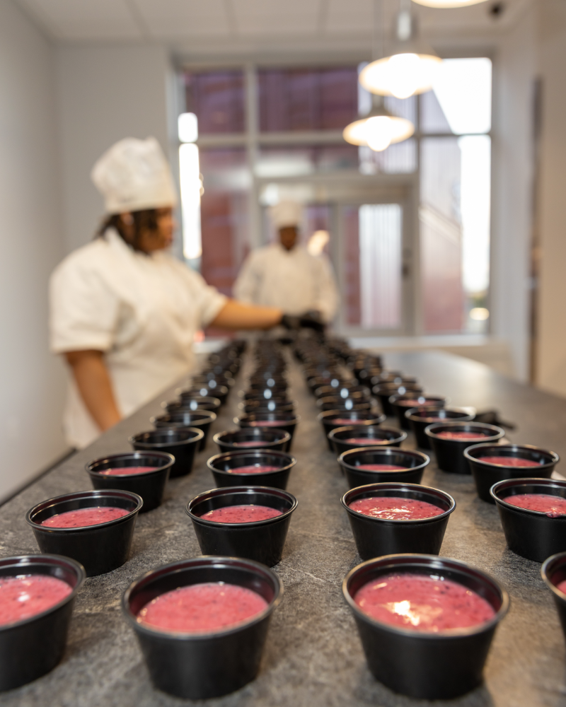 Rows of fresh smoothie servings prepared for guests