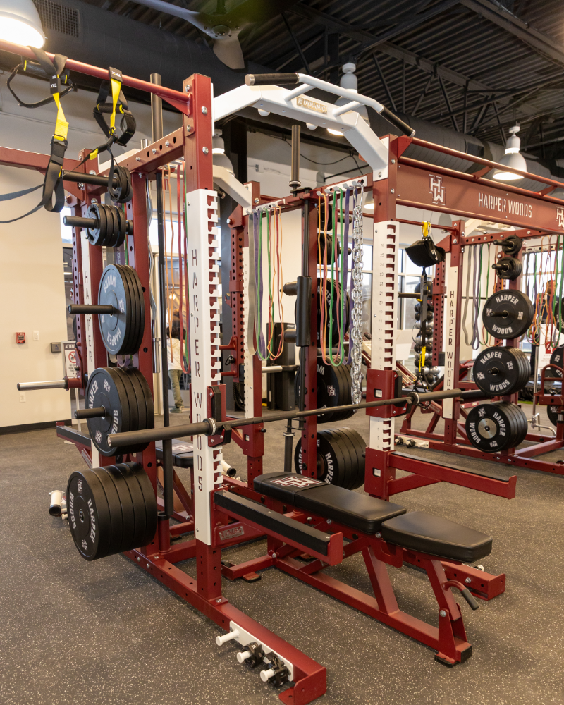 Custom Harper Woods squat racks and benches on the strength floor