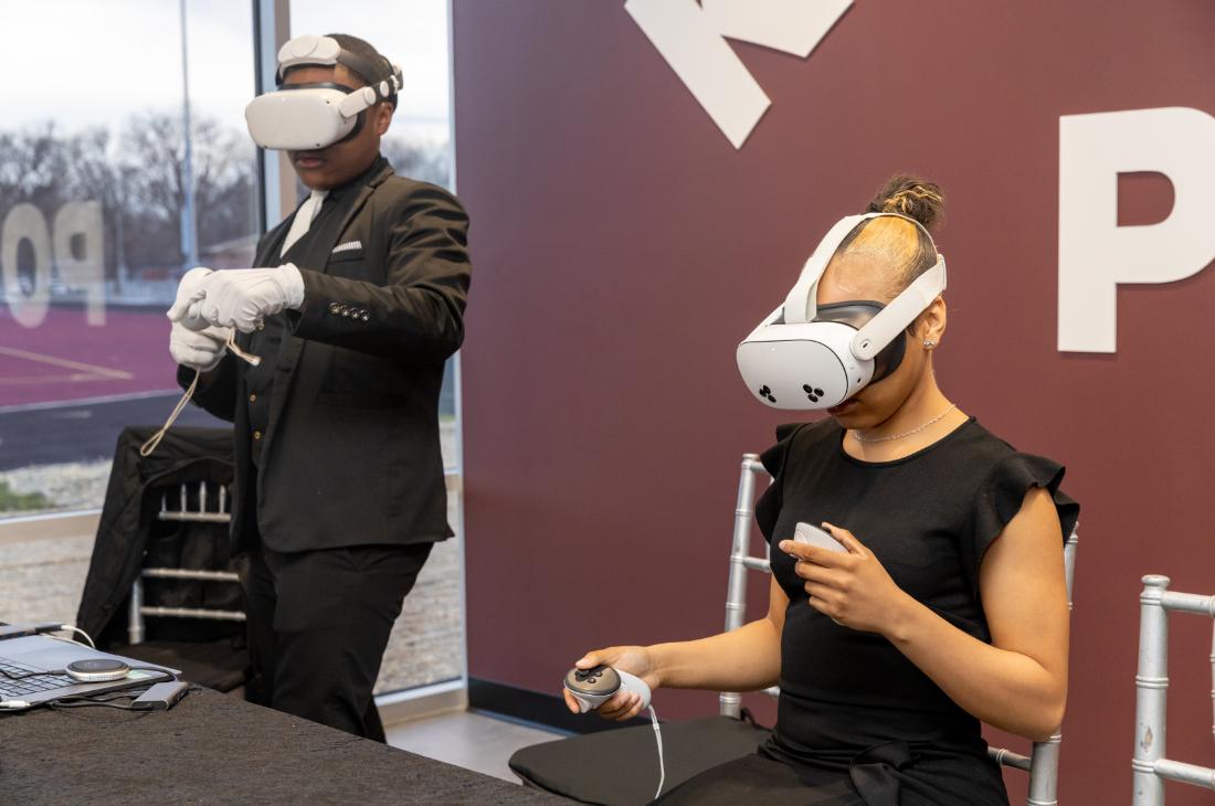 Two students exploring a virtual reality simulation