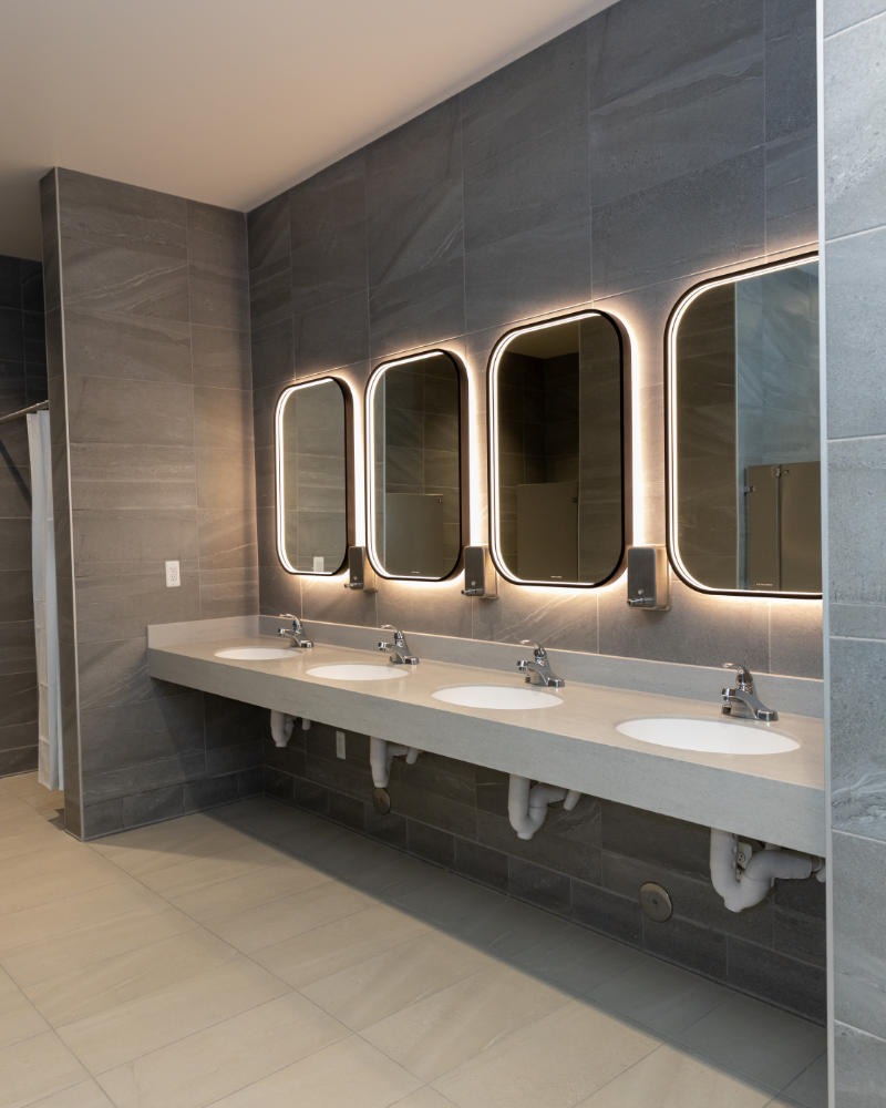 The Excellence Institute washroom with backlit mirrors