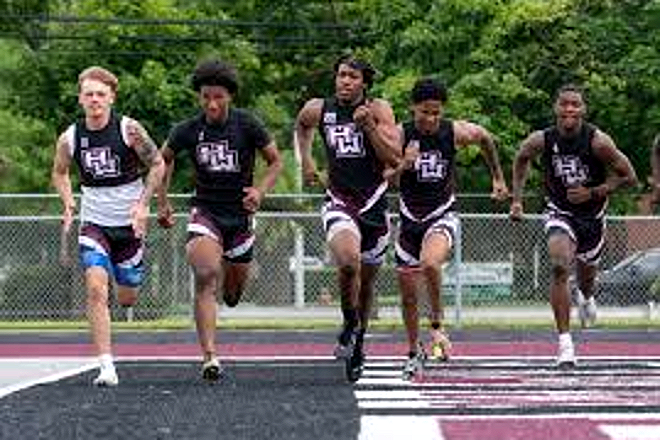 Harper Woods sprinters racing on the track