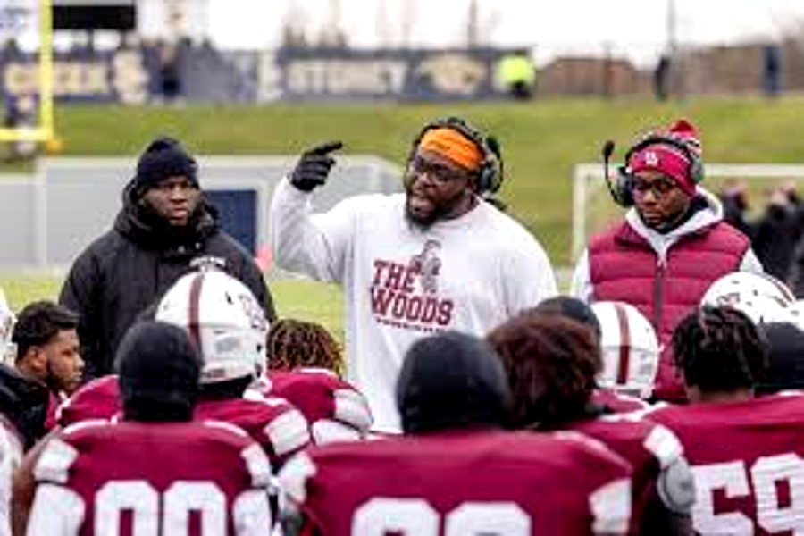 A Harper Woods coach addressing the team on the sideline