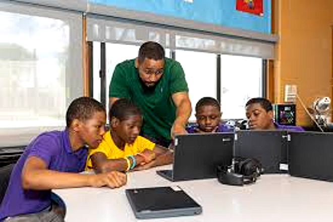 Harper Woods Middle School students working on laptops in class
