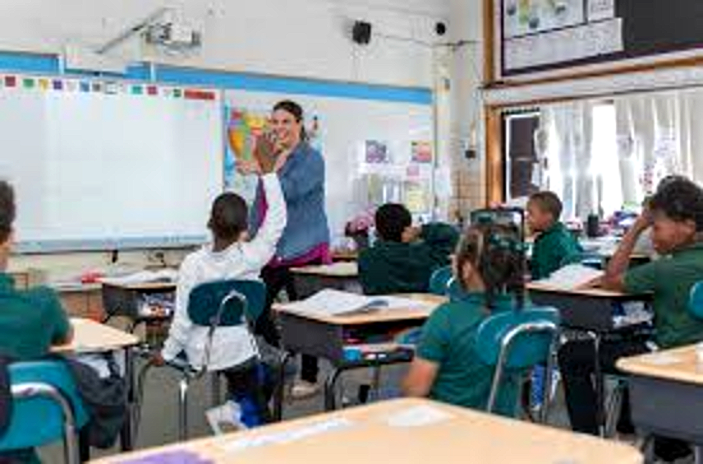A Tyrone teacher leading a lesson in a full classroom