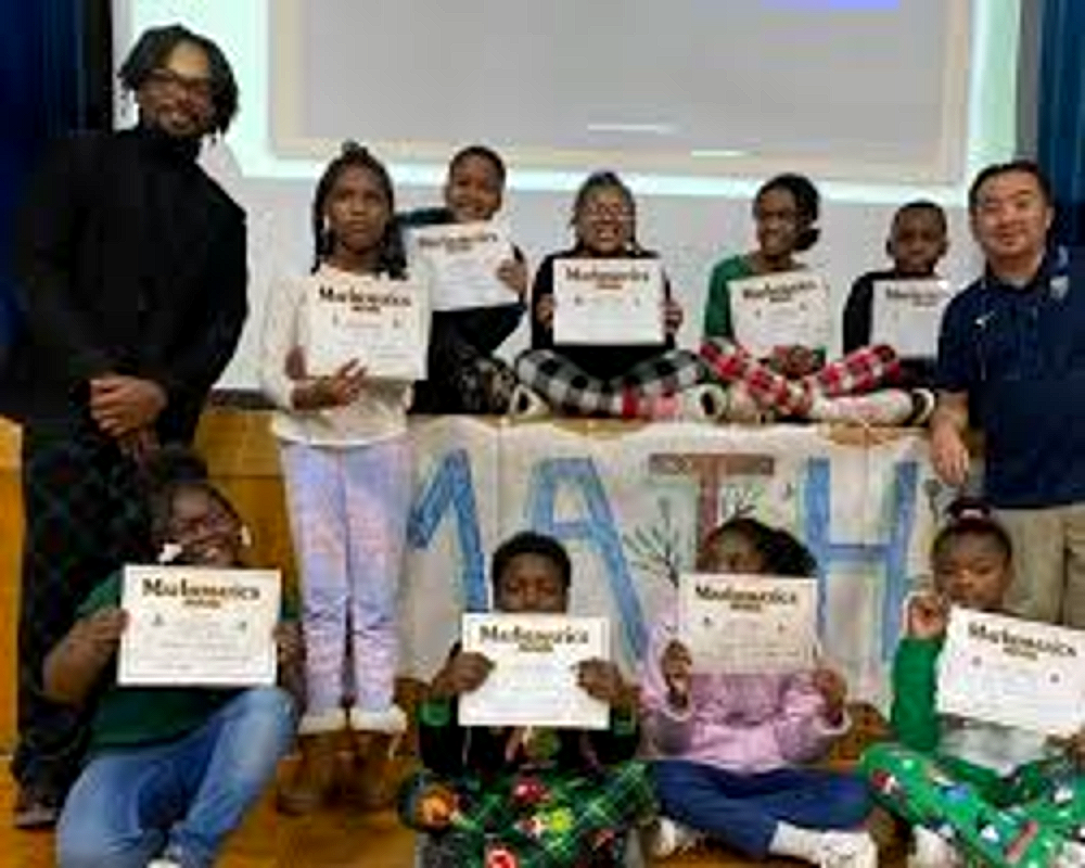 Tyrone students receiving Mathematics achievement awards at an assembly
