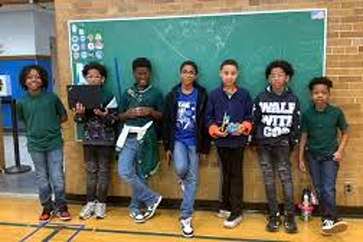 Tyrone students showing off their Lego Robotics builds in the gym